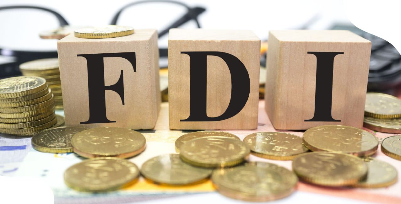 What is foreign direct investment, and what are its economic benefits?